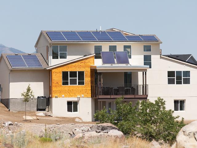 A 10.29-kW solar electric system more than meets the electric needs of the home, while a solar thermal system reduces domestic hot water energy use.