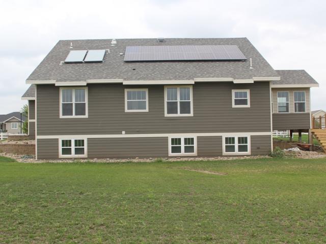 The home takes advantage of natural comfort orientation along with a simple roof design to provide ample space for the 4 kW solar electric system and solar hot water system with two solar panels.