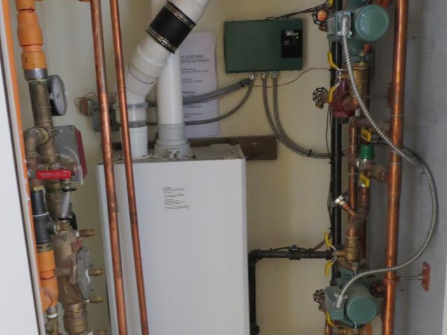 A high-efficiency boiler provides domestic hot water and radiant floor heating.