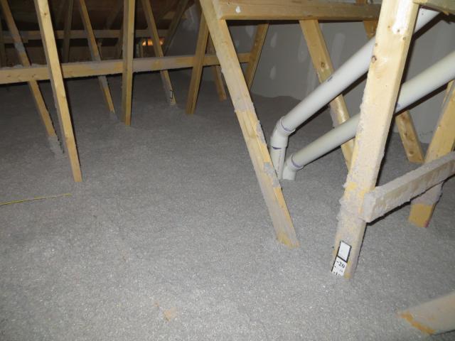 The ultra-efficient attic insulation uses 14 inches (R-52) of blown cellulose, which completely covers the attic floor.