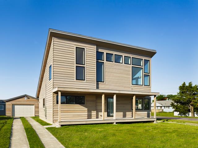 John Hubert Associates' modern take on the traditional beach cottage achieved a Home Energy Rating System (HERS) score of 46 without photovoltaics or a HERS 9 with a solar electric system on the roof.