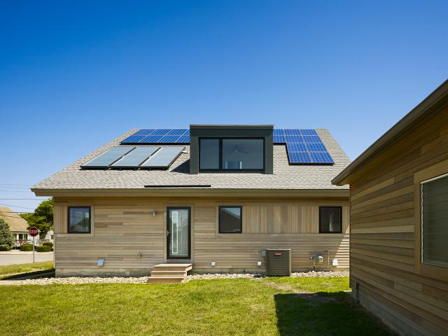 The south-facing orientation maximizes the capture of solar heating in winter while minimizing overheating in summer.