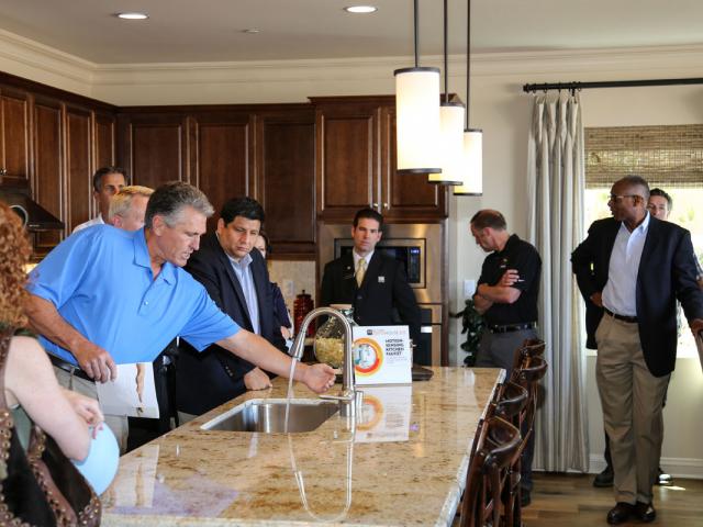 The home's water-saving fixtures, which meet EPA's WaterSense requirements, are demonstrated for visitors.