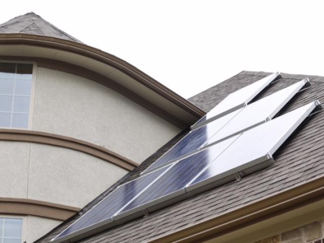 Roof-mounted photovoltaic panels use free energy from the sun to generate electricity.