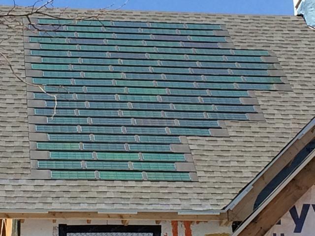 This home has a solar electric system with roof-integrated solar shingles.