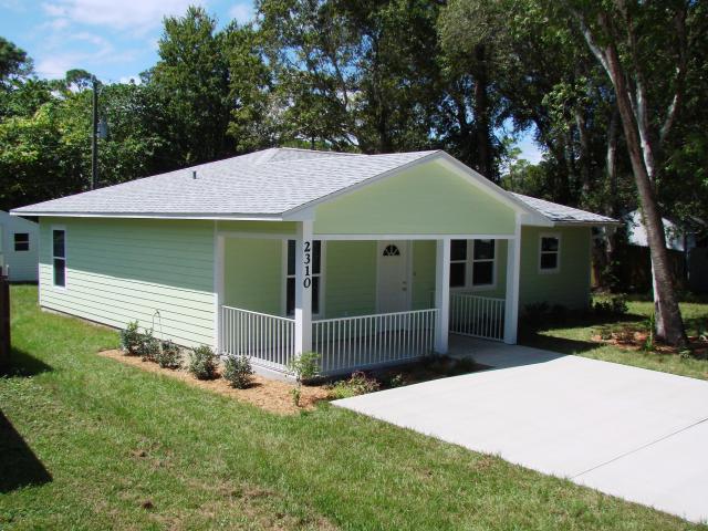 The natural comfort shading of this home is provided by a covered front porch, deep overhangs, and native deciduous trees that help keep interiors comfortably cool in the summer with minimal use of air conditioning.