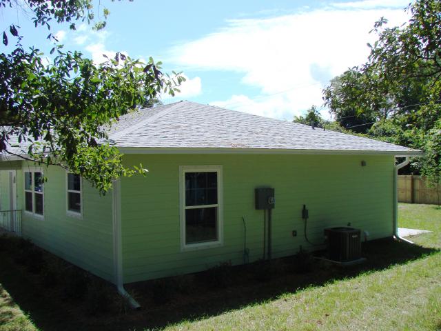 The home's single-story structure, hip-roof design, and bottom course of asphalt shingles are tar glued as well as nailed to the CDX plywood sheathing to make for a wind- and storm-resistant home, while the slab-on-grade concrete foundation and fiber cement siding add to the home's termite resistance.