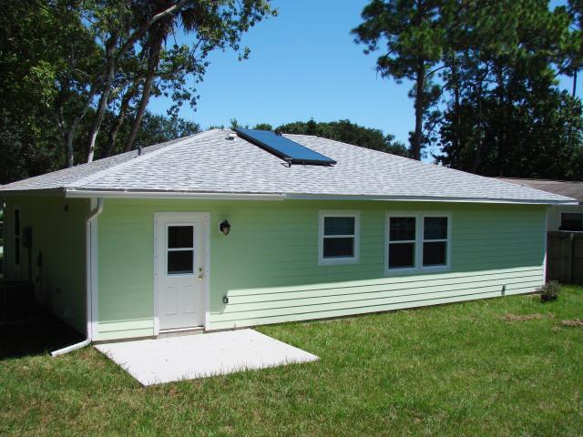 The home's solar hot water system uses 40 square feet of a solar thermal rooftop collector. The roof is covered with asphalt shingles that are light in color to minimize solar heat gain in the attic.