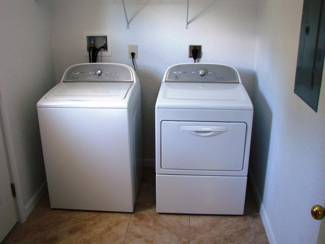 High-efficiency appliances including an ENERGY STAR-labeled dishwasher, clothes washer, and refrigerator reduce energy and water use.