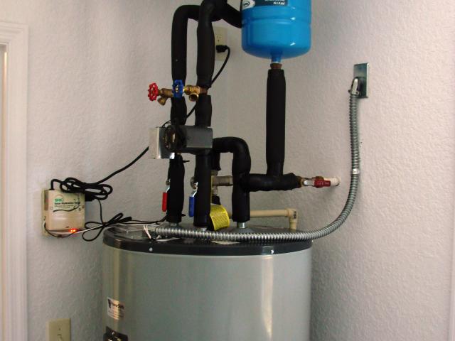 This 80-gallon tank holds water from the solar hot water system, and water-saving fixtures provide additional water heating savings.