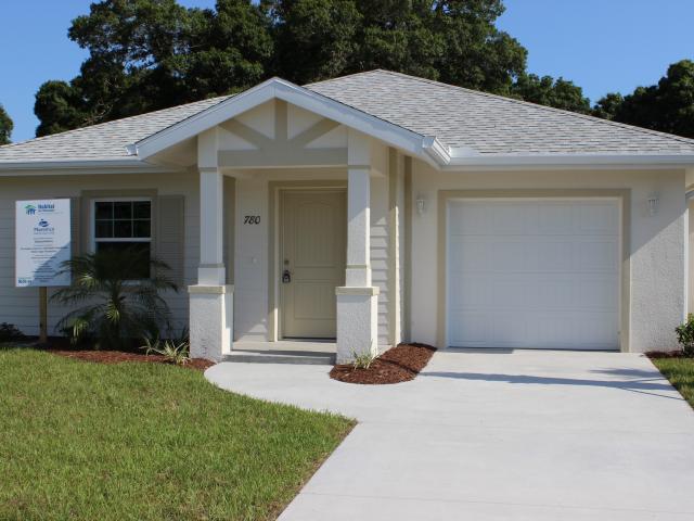 This highly efficient 1,290-square-foot home by Habitat for Humanity of South Sarasota County, Florida, is built to the requirements of the U.S. DOE Zero Energy Ready Home program and has low utility bills of about $72 per month. The roof design adds to the home's storm and wind resistance.