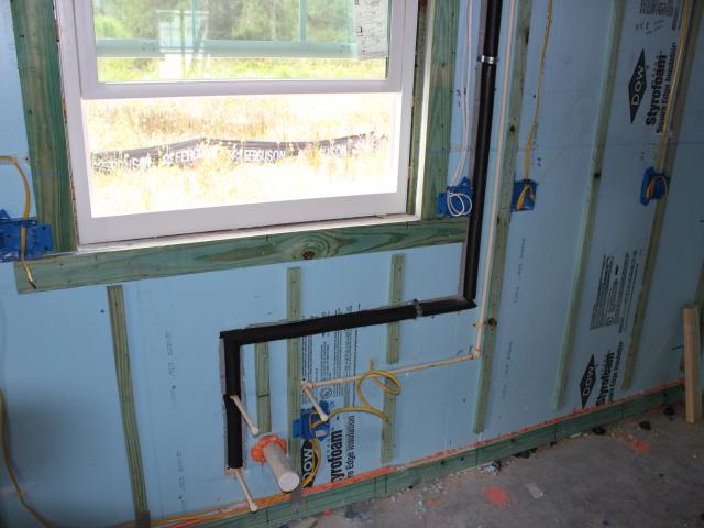 Comprehensive draft protection is provided by sealing all wiring and plumbing penetrations in exterior walls with caulk, spray foam, and rubber gaskets.