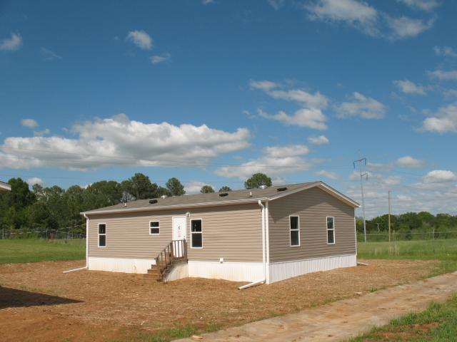 The simple roof design and small footprint common to manufactured homes helps control construction and energy costs including less than $800 per year of expected utility costs.