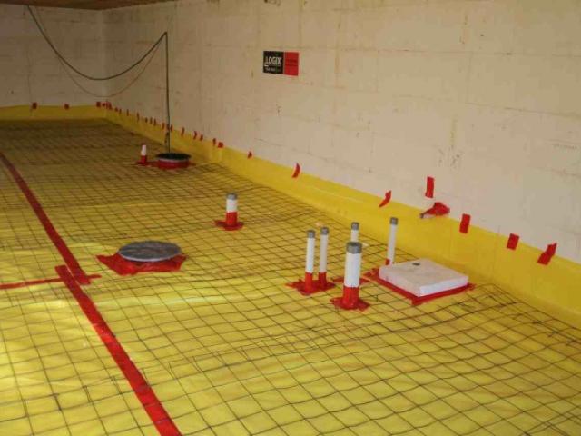 Any holes through the vapor barrier installed over the basement floor slab are thoroughly sealed as part of the foundation water barrier system.